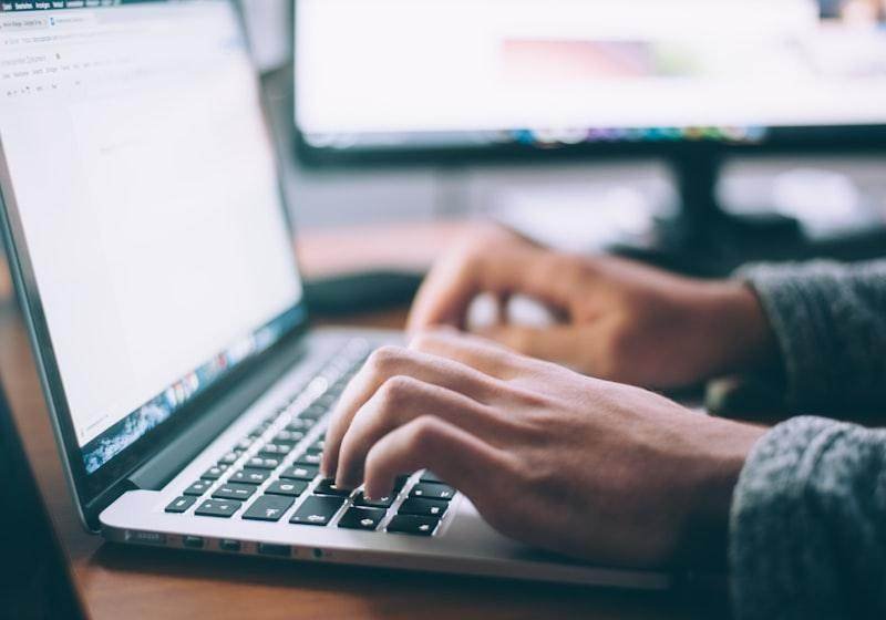 Marketer reviewing campaign results on a laptop